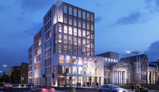 The Grosvenor East building at night, viewed from Oxford Road